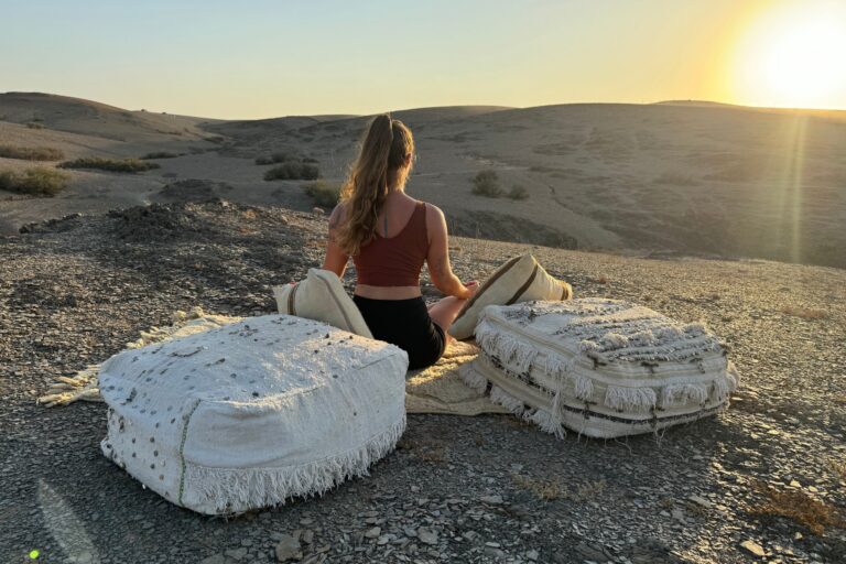 image of a woman doing yoga in the desert